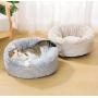 Coussin rond beige et blanc